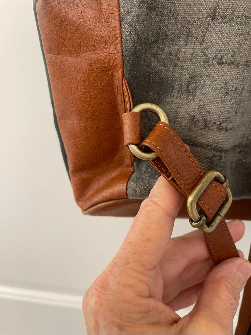 Black Leather Backpack with Brown Trim and Brass Accents